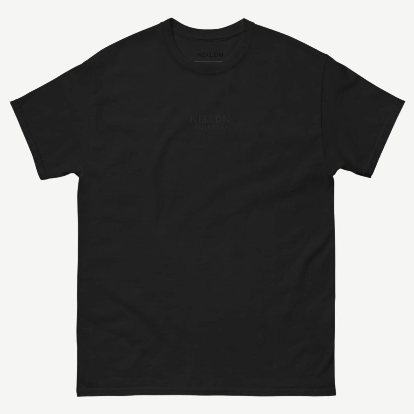 Black Quiet Confidence Tee front view with tonal embroidered NEI.LDN logo